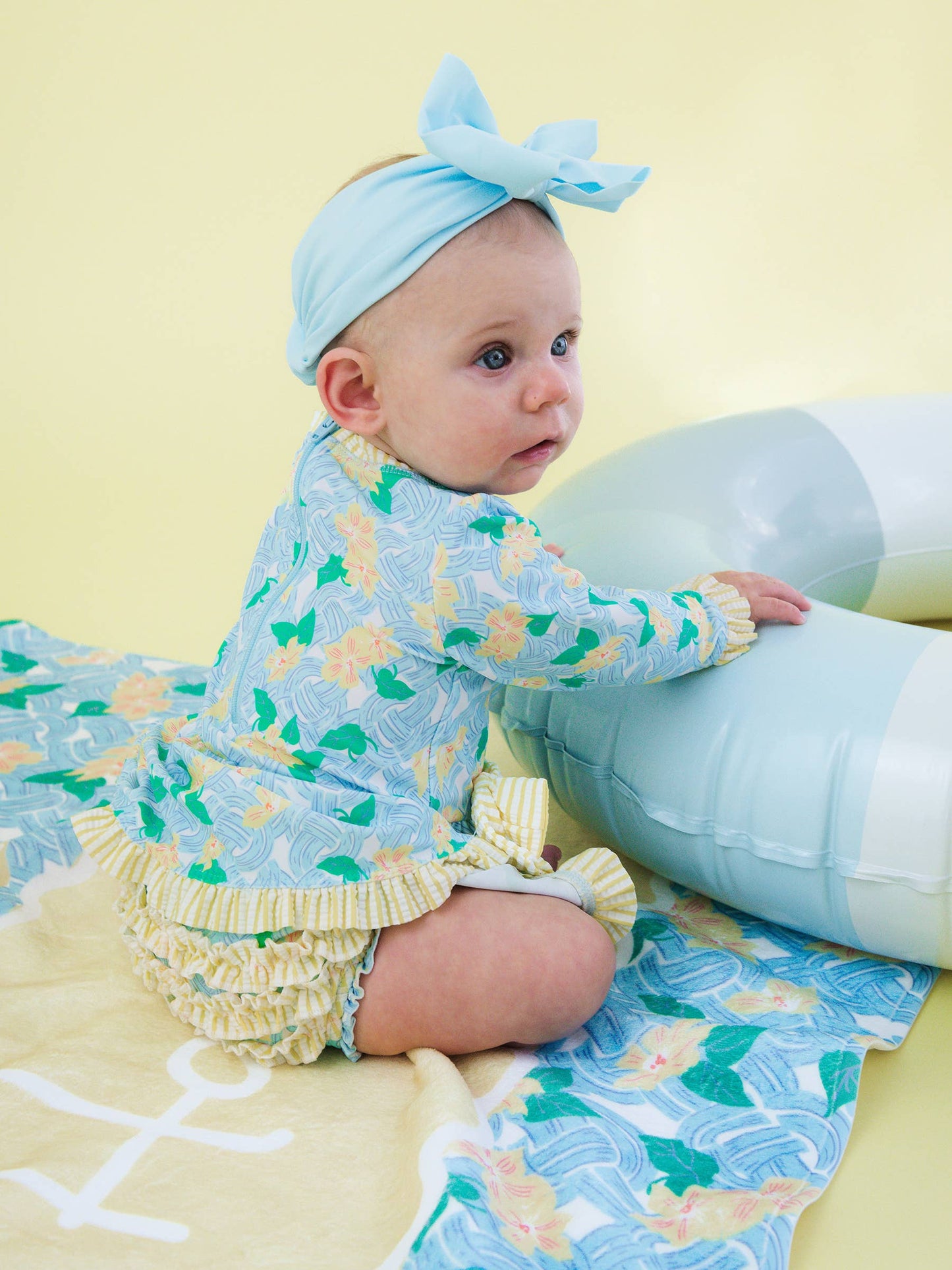 RuffleButts + RuggedButts - Baby Girls Blooming Basket LS OP Bow Peplum RG Swimsuit wi/Ruffles