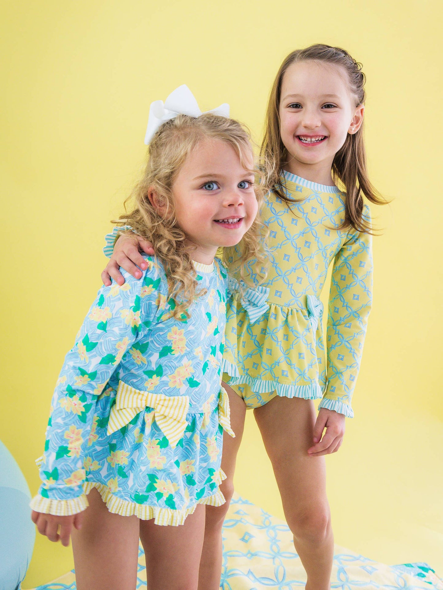 RuffleButts + RuggedButts -  Blooming Basket LS OP Bow Peplum RG Swimsuit