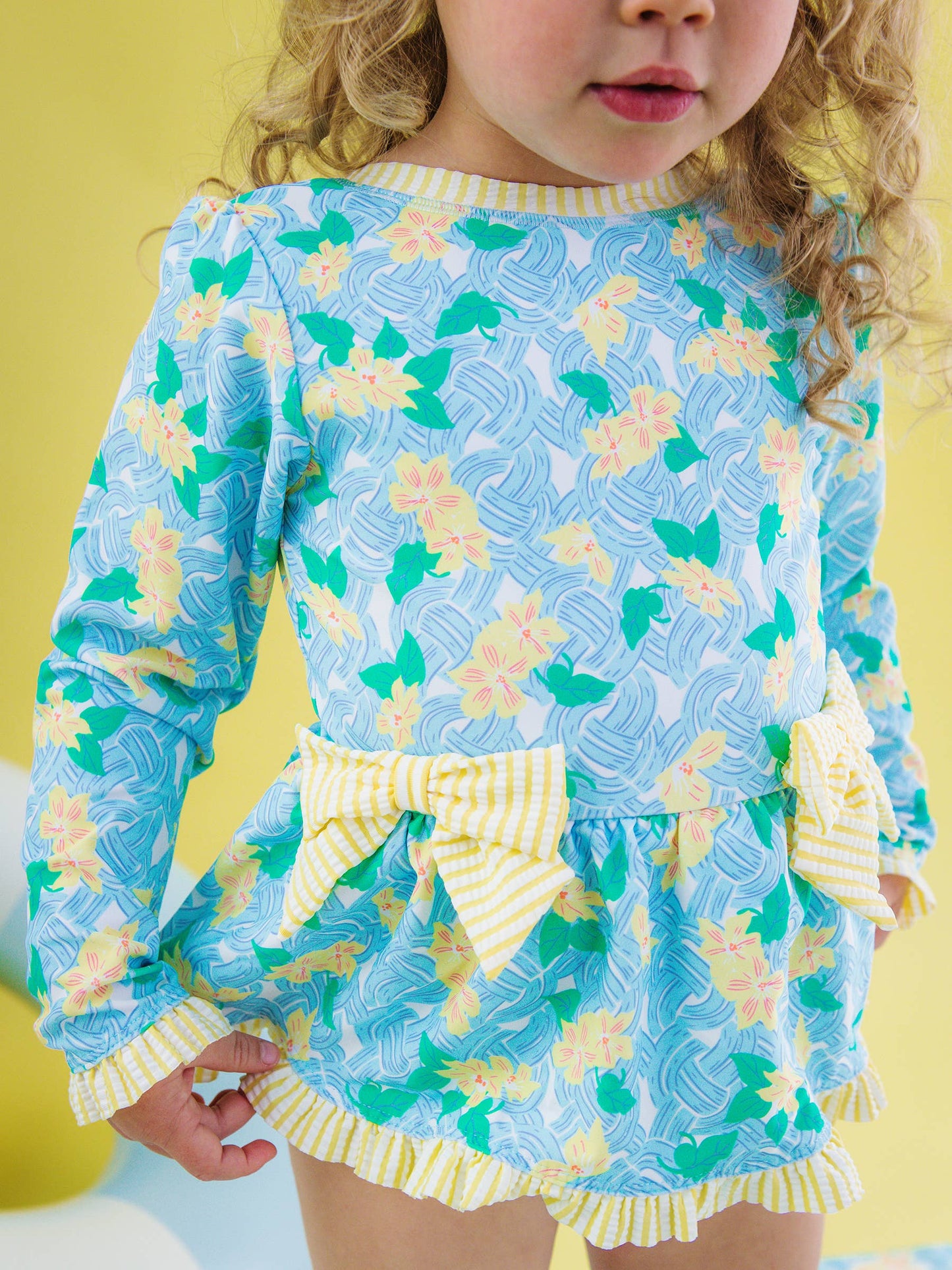 RuffleButts + RuggedButts -  Blooming Basket LS OP Bow Peplum RG Swimsuit