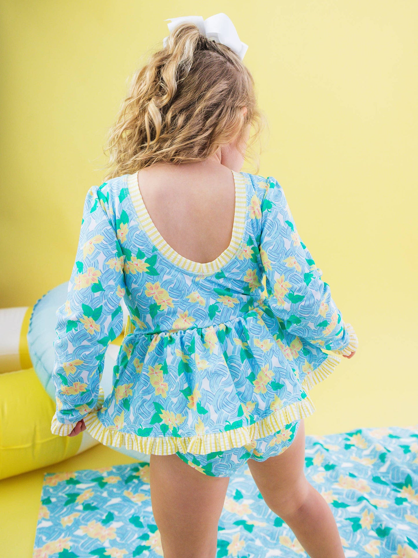 RuffleButts + RuggedButts -  Blooming Basket LS OP Bow Peplum RG Swimsuit