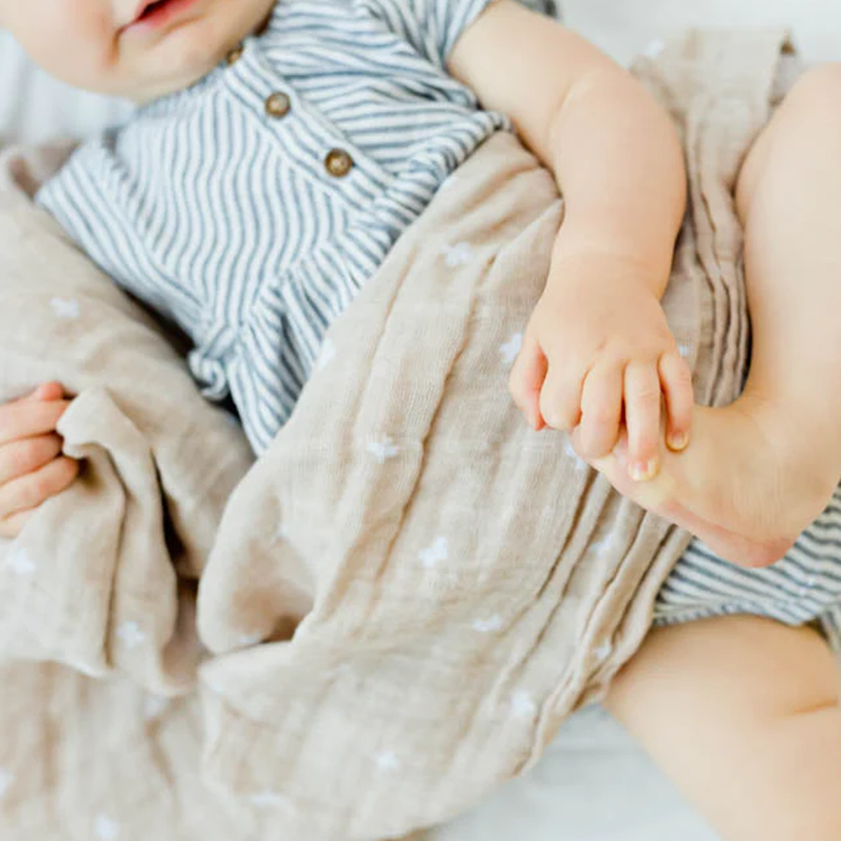 Little Unicorn - Cotton Muslin Swaddle Blanket - Taupe Cross