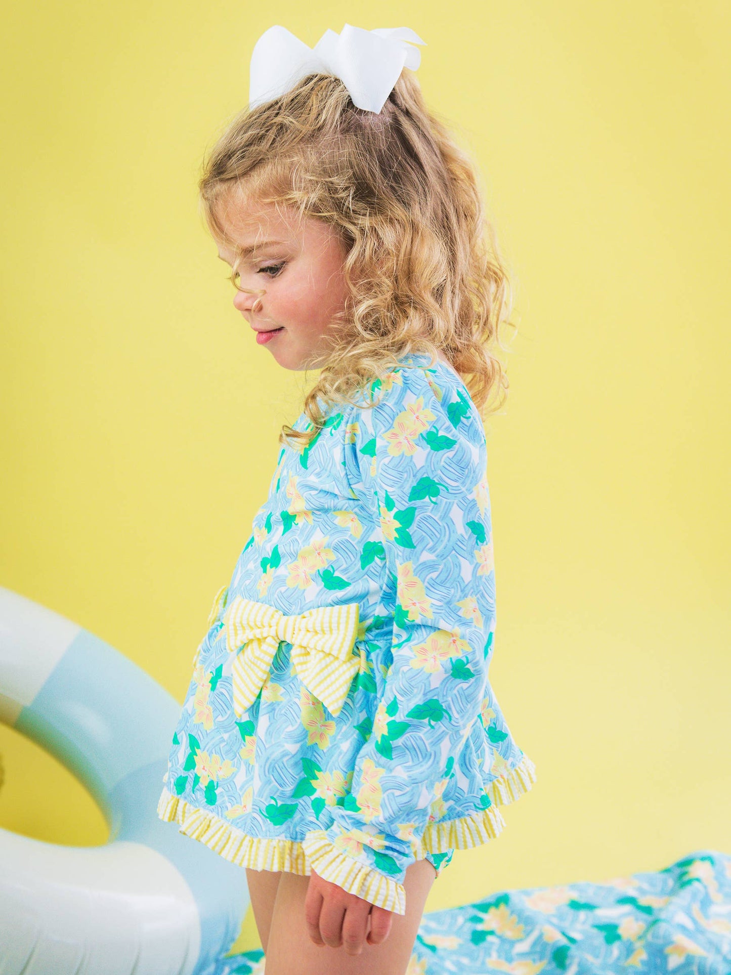 RuffleButts + RuggedButts -  Blooming Basket LS OP Bow Peplum RG Swimsuit